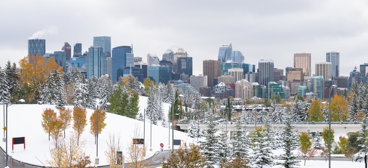 A snowy shot shows the downtown Calgary skyline.