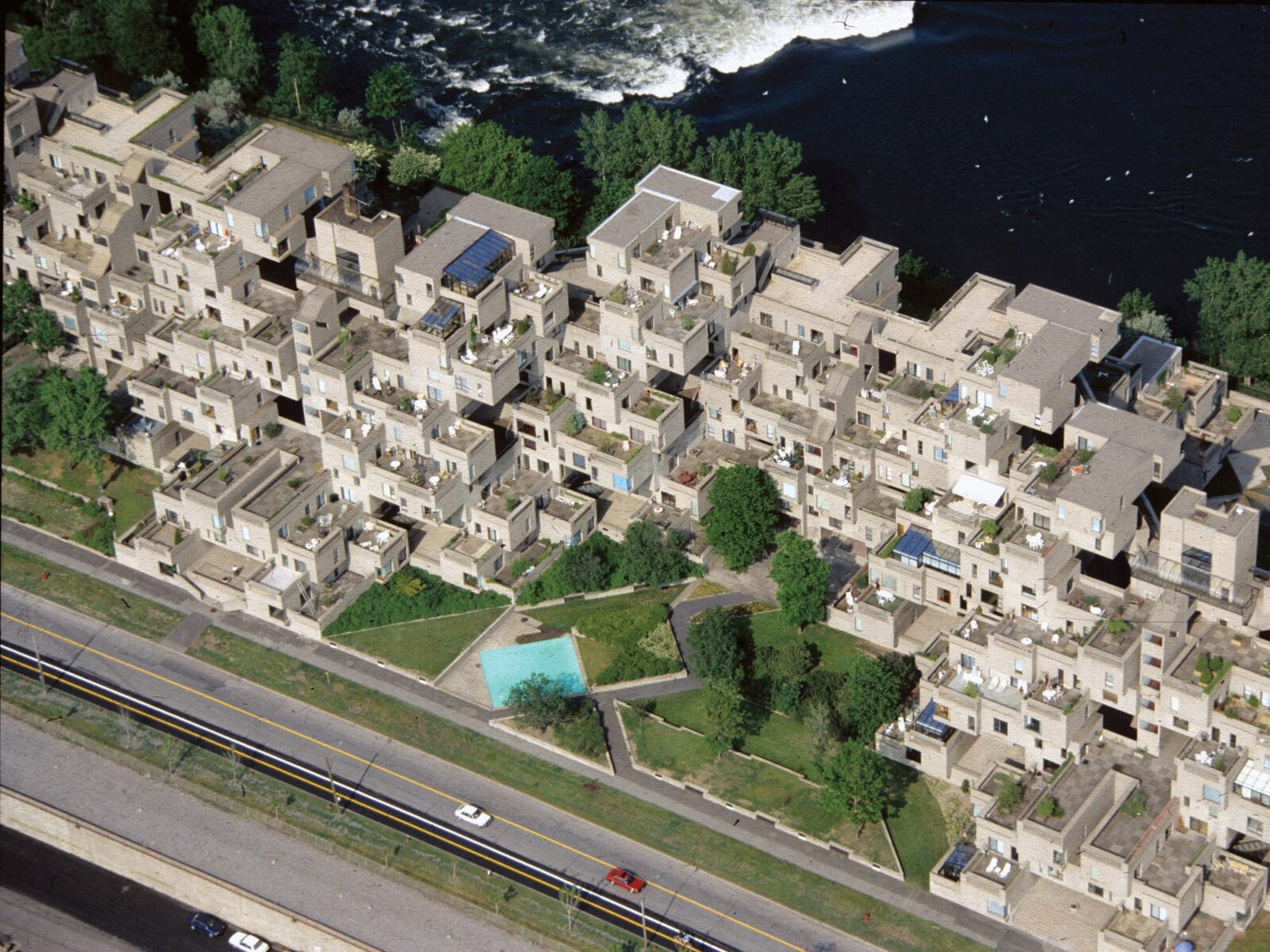 A bird's eye view shows the iconic Habitat 67 building in Montreal.
