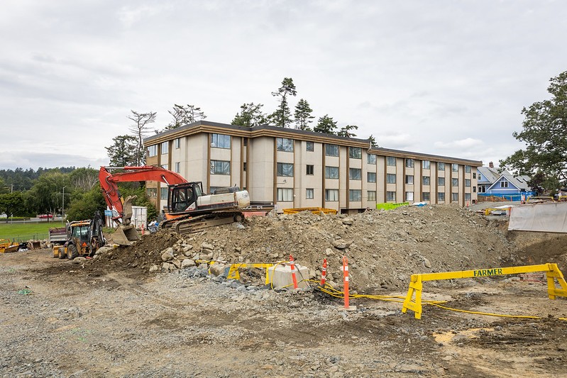 A backhoe digs at a housing project in Esquimalt, B.C.