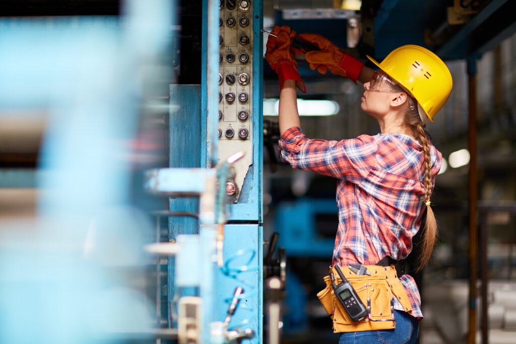 A female electrician practices her skills in Ontario.